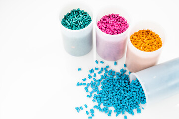 Obraz na płótnie Canvas Plastic granules close up for holding,Colorful Plastic granules with white background.