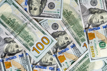 100 dollar bills texture over the table