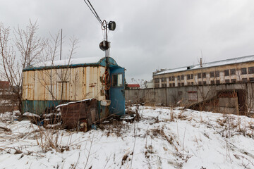 abandoned security booth in the snow