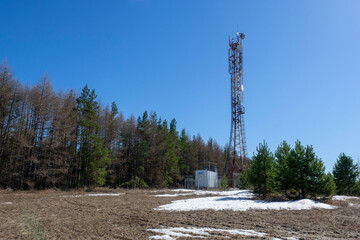 Metal tower antenna digital television transmitter. Mobile cellular tower. - obrazy, fototapety, plakaty