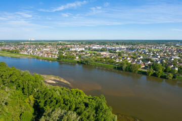 Fototapeta na wymiar The town of Sully sur Loire on the banks of the Loire in Europe, in France, in the Center region, in the Loiret, in summer, on a sunny day.