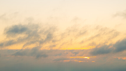 the sun breaks through the morning cloudy sky