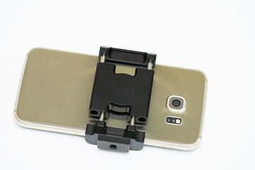 mobile phone and  black  metallic support 