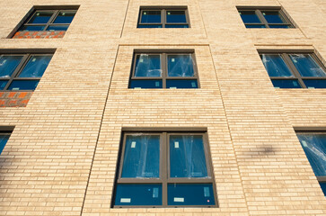 the wall of a new house with glazed windows