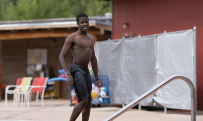 Young Colored man just out of the swimming pool.