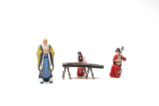 a mini figure female artist playing the Guzheng and lute
