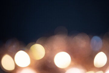 Blurred Christmas lights over dark blue background