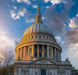 Fototapeta na wymiar St Paul's Cathedral over evening sky clouds in London, England.