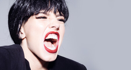 Excited angry woman screaming and shouting. Human emotions, facial expression concept. Shout and scream mouth.