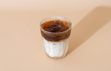 iced coffee with milk layer in glass