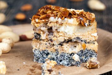 sweet cake with buttercream and sponge cake and lots of poppy seeds and nuts