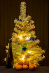 New Year's composition. Christmas tree with glass colorful balls and gifts