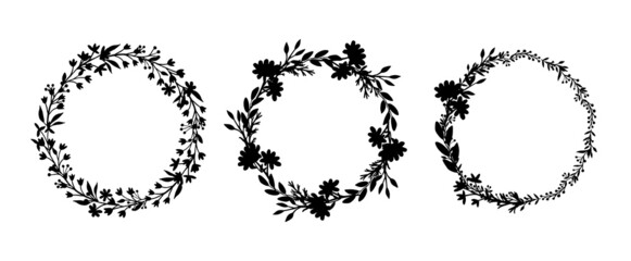 Set of silhouettes of wreaths of field herbs and plants. Black vector round frames isolated on white background. Medicinal flowers, twigs, leaves.