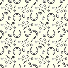 Vector graphics. Seamless pattern with four-leaf clover, horseshoes and coins. 