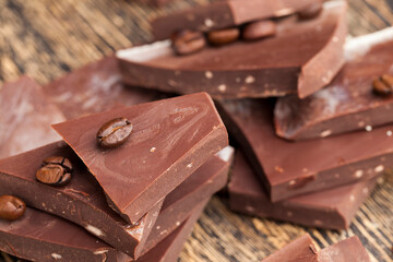 coffee and pieces of milk chocolate from cocoa