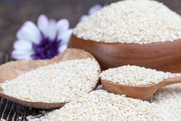 white sesame seeds on a wooden table