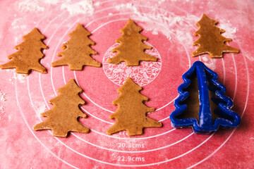 Christmas tree gingerbread cookies, home baking process. Family leisure. Christmas mood.