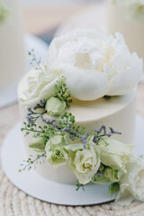 White wedding cake decorated with white flowers