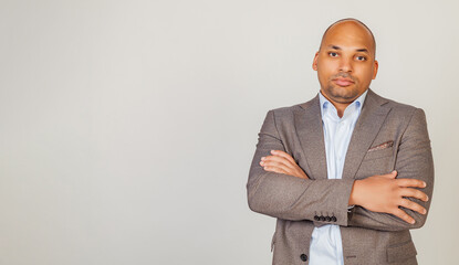 An African American man crossed his arms over his chest. Young b