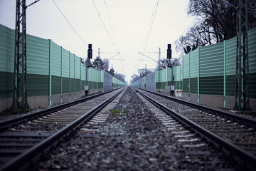 Railroad noise barrier. Acoustic wall reducing train sound. Soundproof protection fence along the railway.