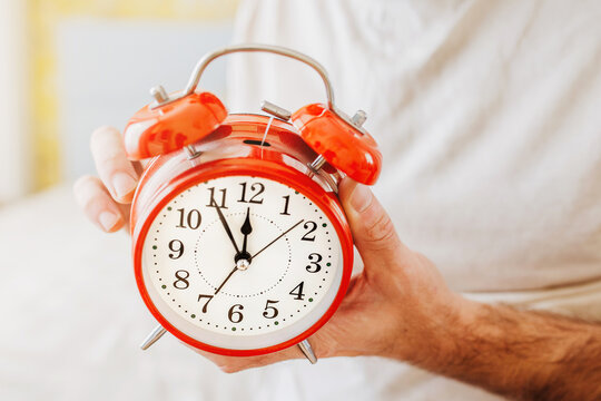 The Man Sets The Alarm Clock At 19 - Daytime Sleep After The Night Shift - Daily Routine For An Owl