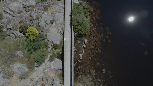 A drone flies in the opposite direction of tourists at Cov&atilde;o dos Conchos.