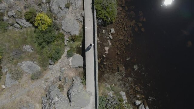 Drone follows a tourist walking in a satellite birdseye view at Cov&atilde;o dos Conchos.