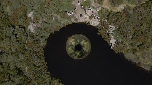 A drone spins over the drain in the manmade lake at Cov&atilde;o dos Conchos