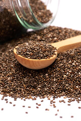 glass can full of organic natural chia seeds close-up isolated on white background
