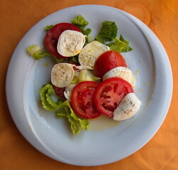 Tomatoes Caprese with mozarella in a restaurant in Italy, Europe

