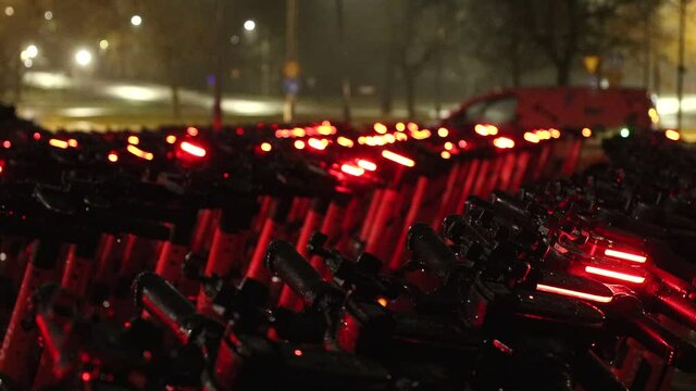 Stockholm, Sweden  A large collection of Voi scooters in the parking lot of its local headquarters.