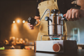 slow bar coffee cafe concept, barista maker are making a hot drink into a cup, vintage filter mage
