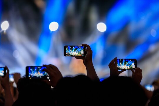 crowd of people at concert - Powered by Adobe