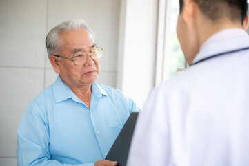 Fototapeta premium old senior patient man visit doctor at hospital to medical health care check, health insurance