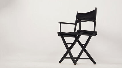 Black director chair isolated on white background. - obrazy, fototapety, plakaty