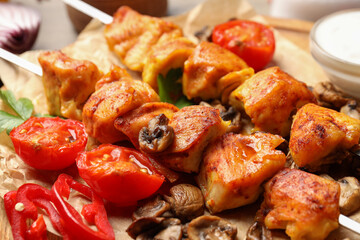 Concept of tasty food with chicken shashlik on light wooden background