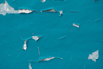 an old iron wall with old paint that has become dull and rusty due to time and weather conditions.  close-up.  can be used as a photo background