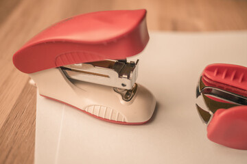 red stapler and staples
