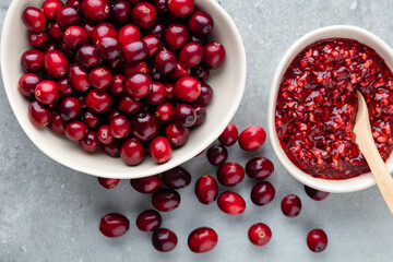 Red berries on a dark background. cranberries in a bowl.