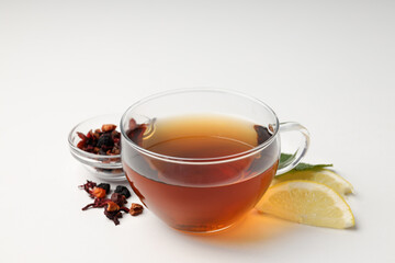 Concept of hot drink with tea on white background