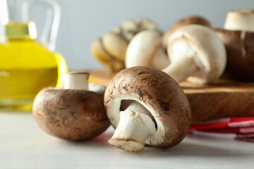Concept of cooking with mushroom on white wooden table