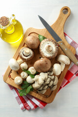 Concept of cooking with mushroom on white wooden