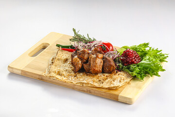 Pork meat shashlik served salad