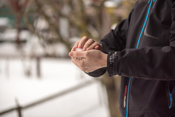 Winter time. Hands holding a snow ball.