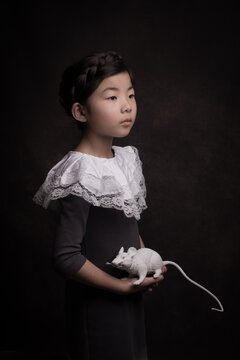 Renaissance portrait of girl with classic collar and holding white mouse