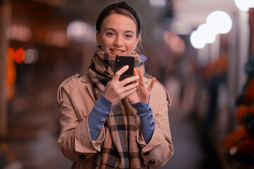 young adult model outdoors outside with phone