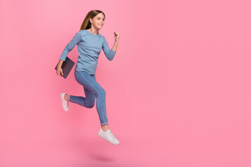 Fototapeta na wymiar Full size profile side photo of young girl jump runner fast look empty space hold laptop courses isolated over pink color background