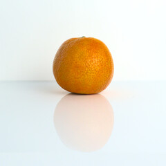 Mandarin. Mandarin is reflected on the surface.
