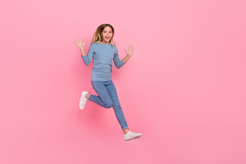 Fototapeta na wymiar Full body photo of young pretty girl walk jump wave arms hello energetic isolated over pink color background