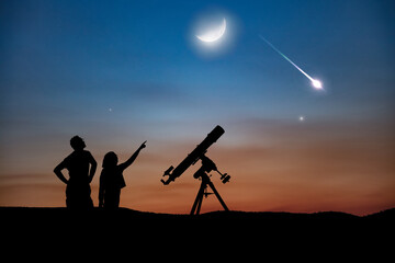 Silhouettes of father, daughter and astronomical telescope under starry skies.
